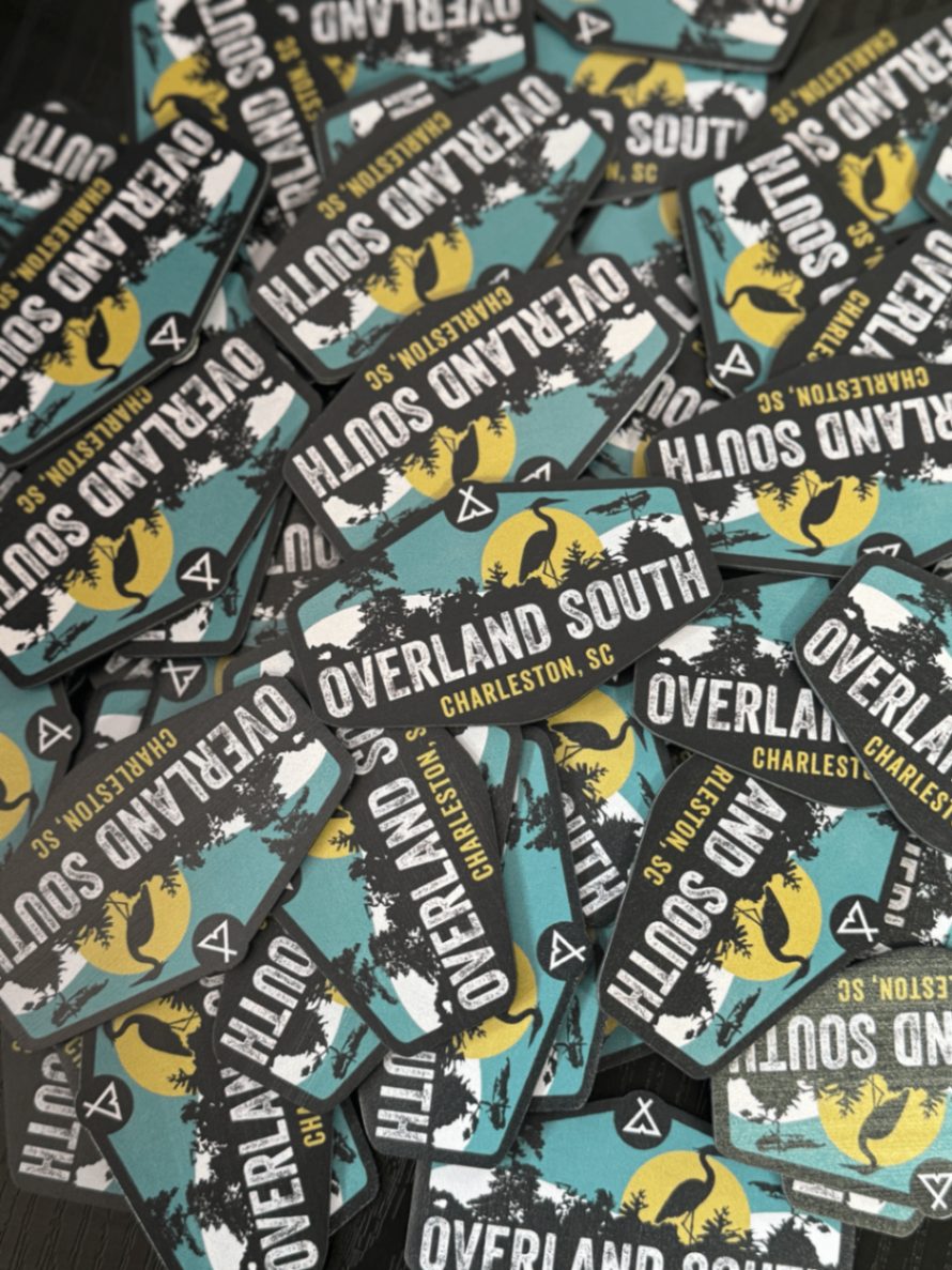 Pile of die-cut Overland South Charleston SC vinyl stickers