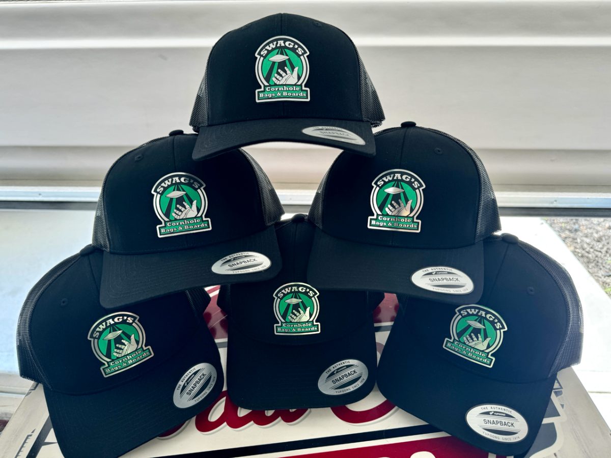 Six black snapback trucker caps with full-color SWAG's Cornhole Bags & Boards patches